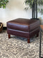 Leather Ottoman With Nailhead Finish