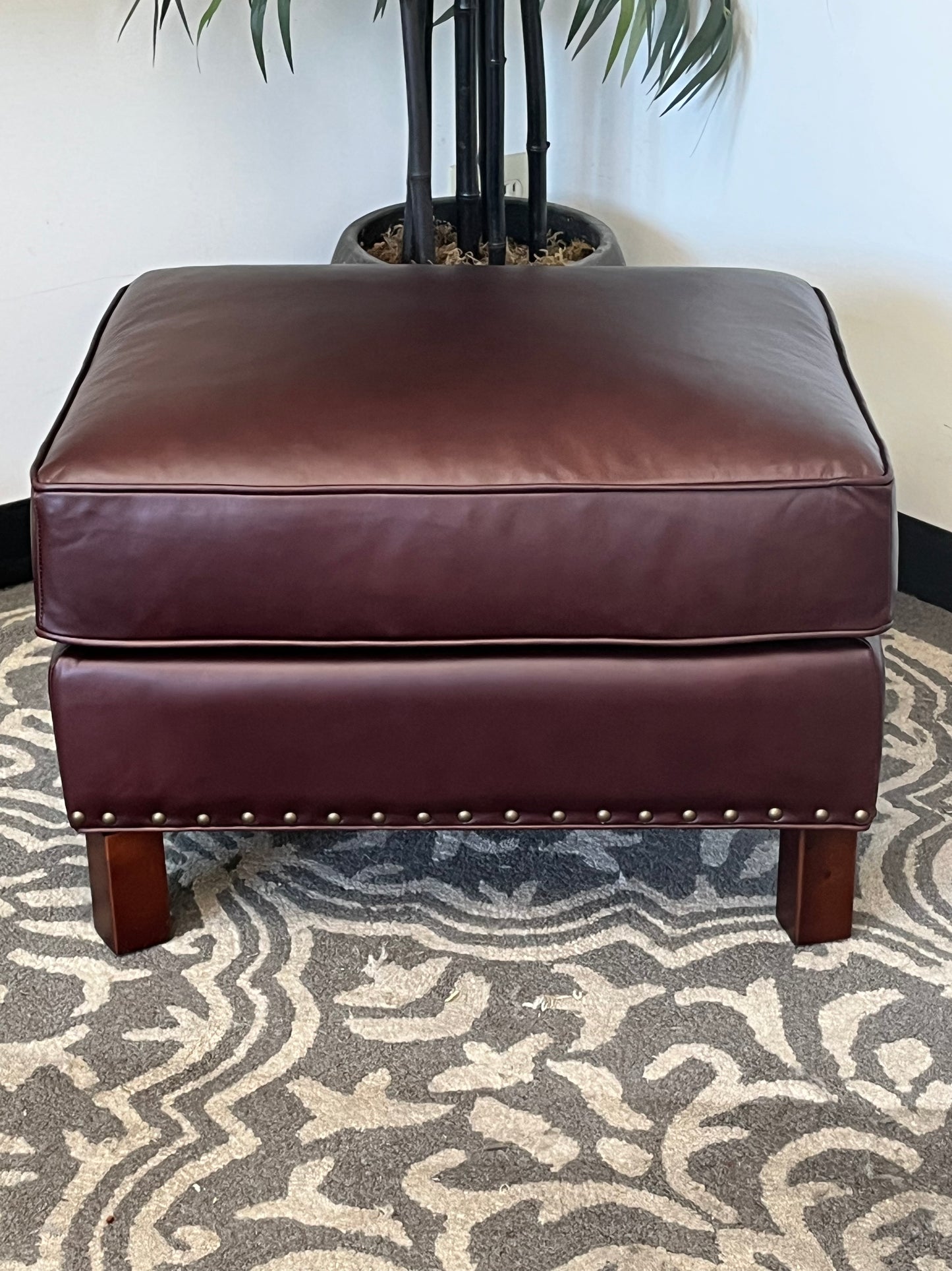 Leather Ottoman With Nailhead Finish