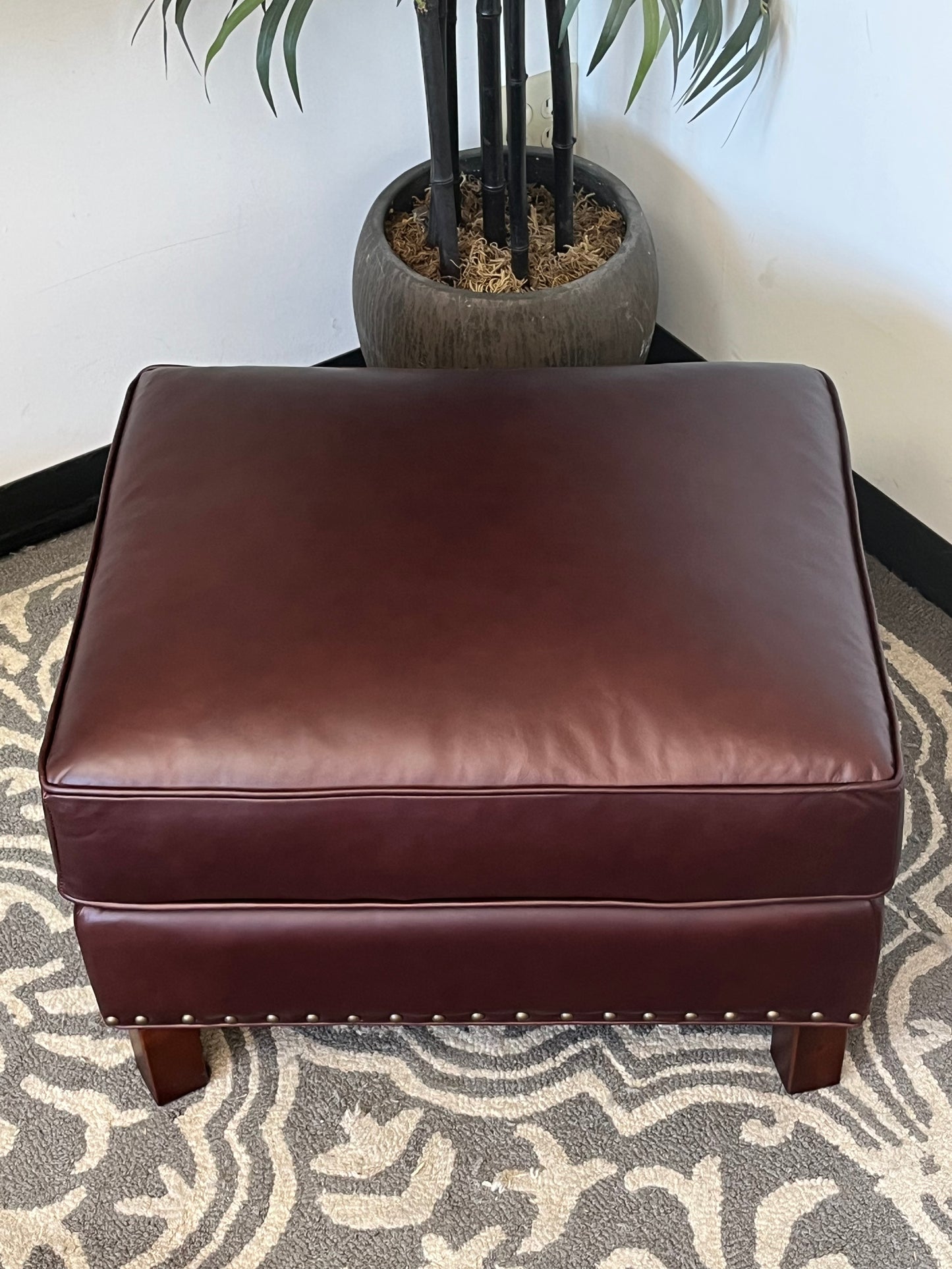 Leather Ottoman With Nailhead Finish