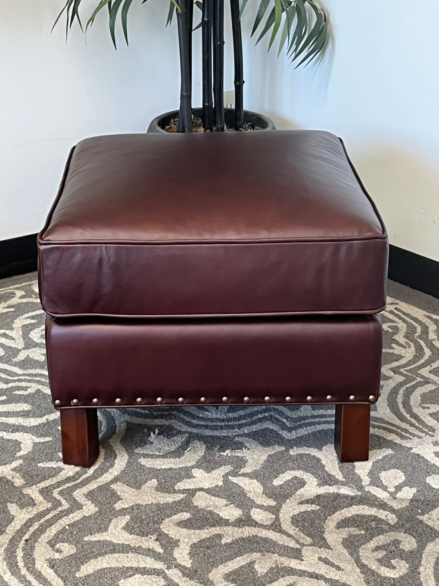 Leather Ottoman With Nailhead Finish